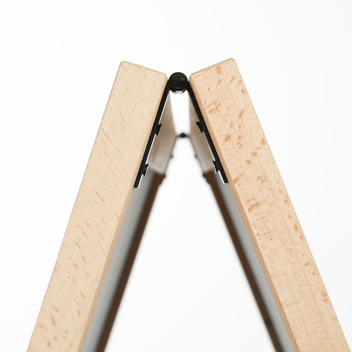 View from above of the hinge holding the two timber legs of a blackboard A-frame together