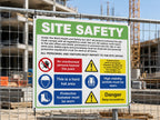 Site safety sign cable tied to construction fencing, listing site rules and safety symbols
