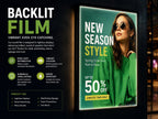 Backlit film poster glowing in an illuminated lightbox display showing a retail fashion campaign at night