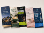 Five DL flyers fanned out for a real estate agency, cafe, gym, beauty brand and plumbing business