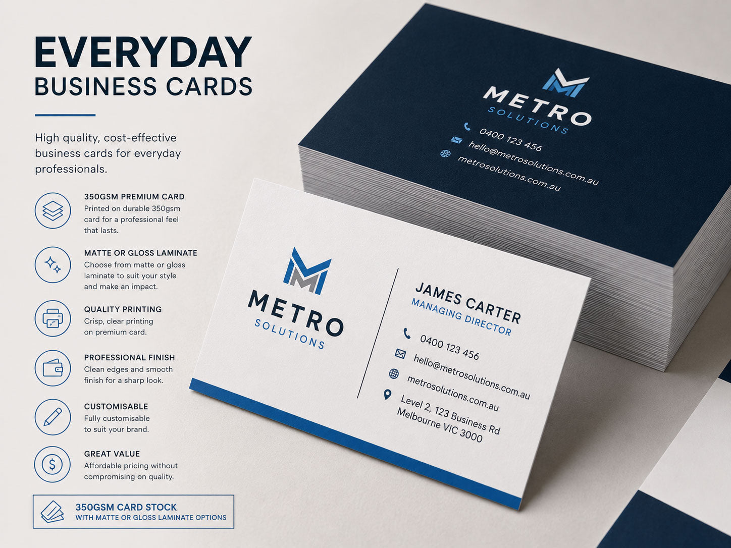 Stack of navy and white business cards with a blue edge, fanned to show both sides of the design