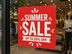 Red Summer Sale poster printed on adhesive vinyl and applied to the inside of a clothing shop window