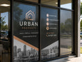 One way vision window graphics covering the glass frontage of a real estate office, seen from outside