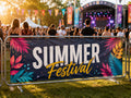 Printed PVC banner cable tied to crowd barriers at an outdoor summer music festival