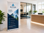 Pull up banner stand for an IT consultancy set up in an office reception beside a boardroom