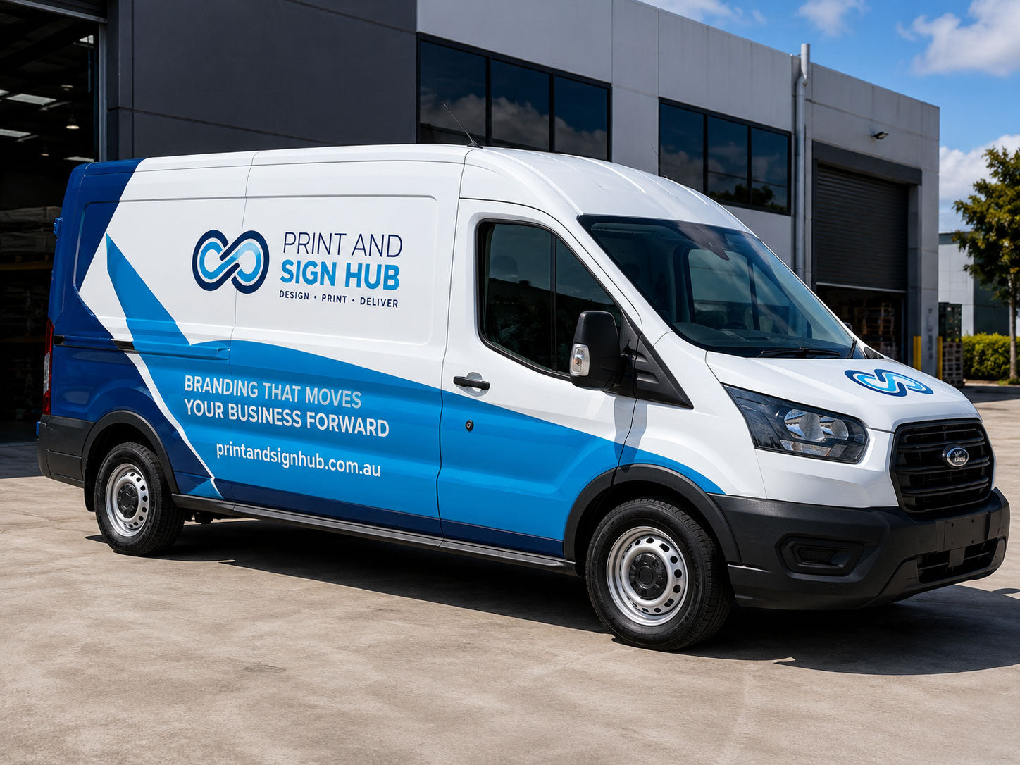 Print and Sign Hub van fully wrapped in printed vinyl, parked outside a commercial building