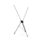 Black X frame tripod stand standing empty, showing the X shaped arms that tension the banner