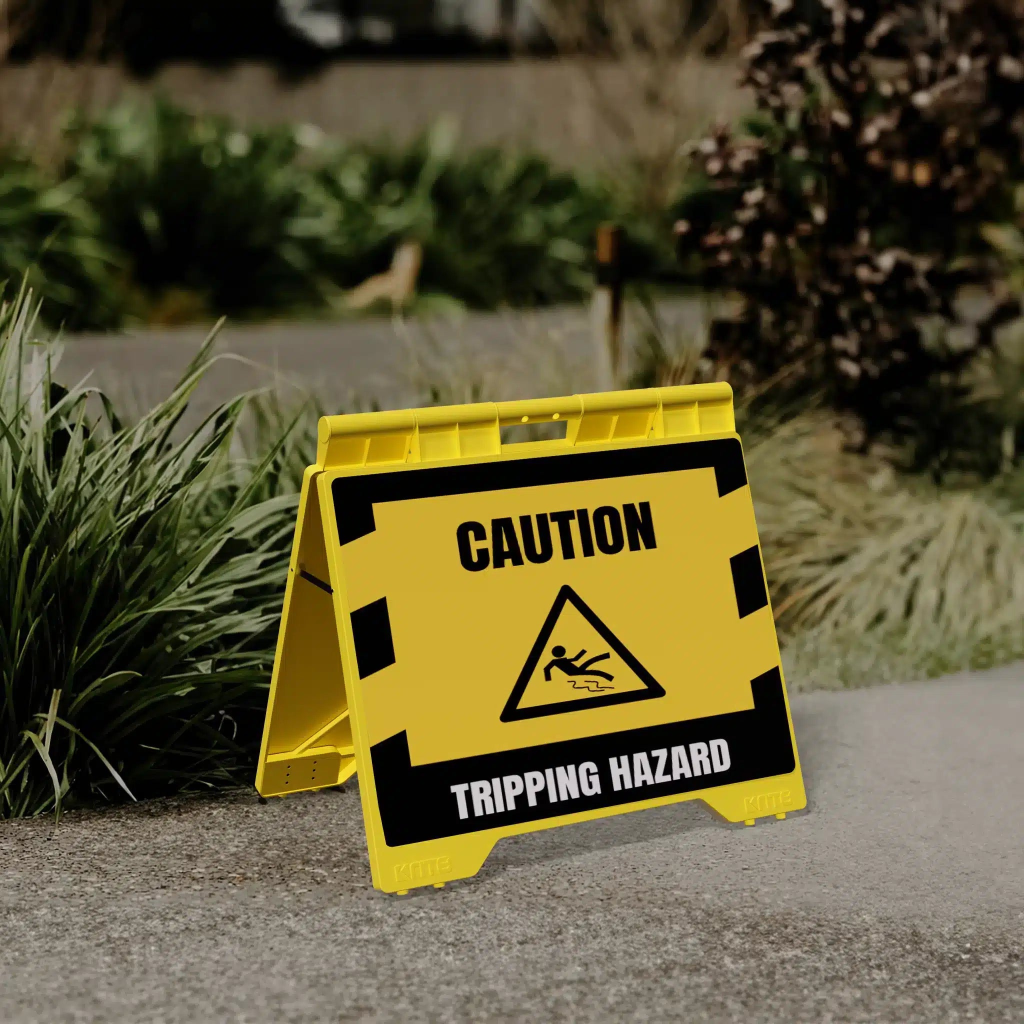Yellow Evarite A-frame with a caution tripping hazard message