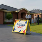 Auction today sign in a flute insertable A-frame on a lawn