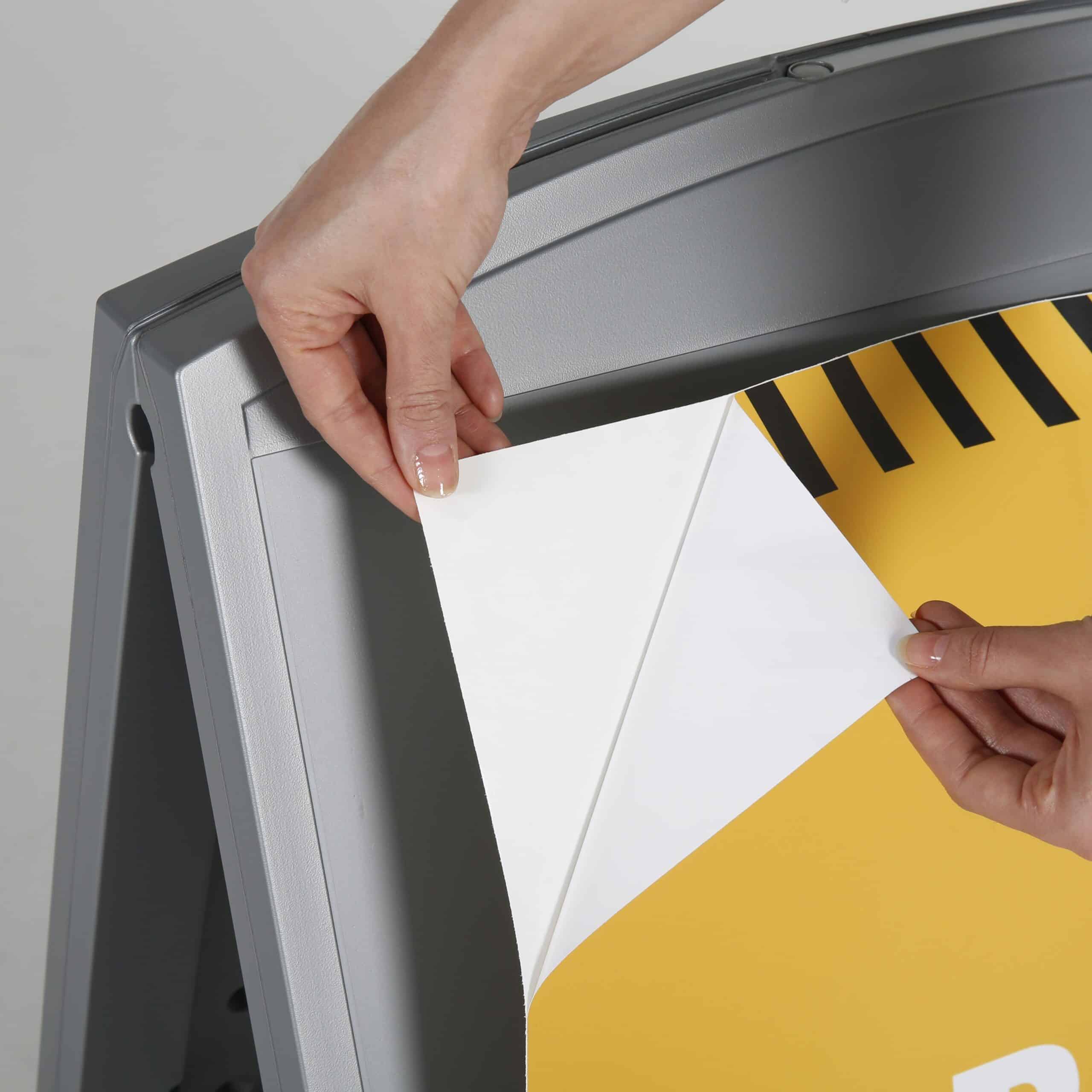 Changing the printed panel in the snap-open frame