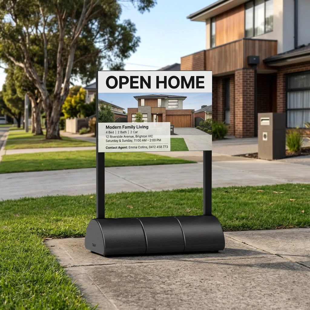 Open home sign on a water-fill base outside a house
